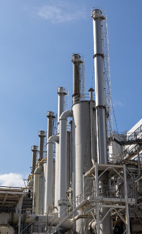 Tall metal processing towers at facility