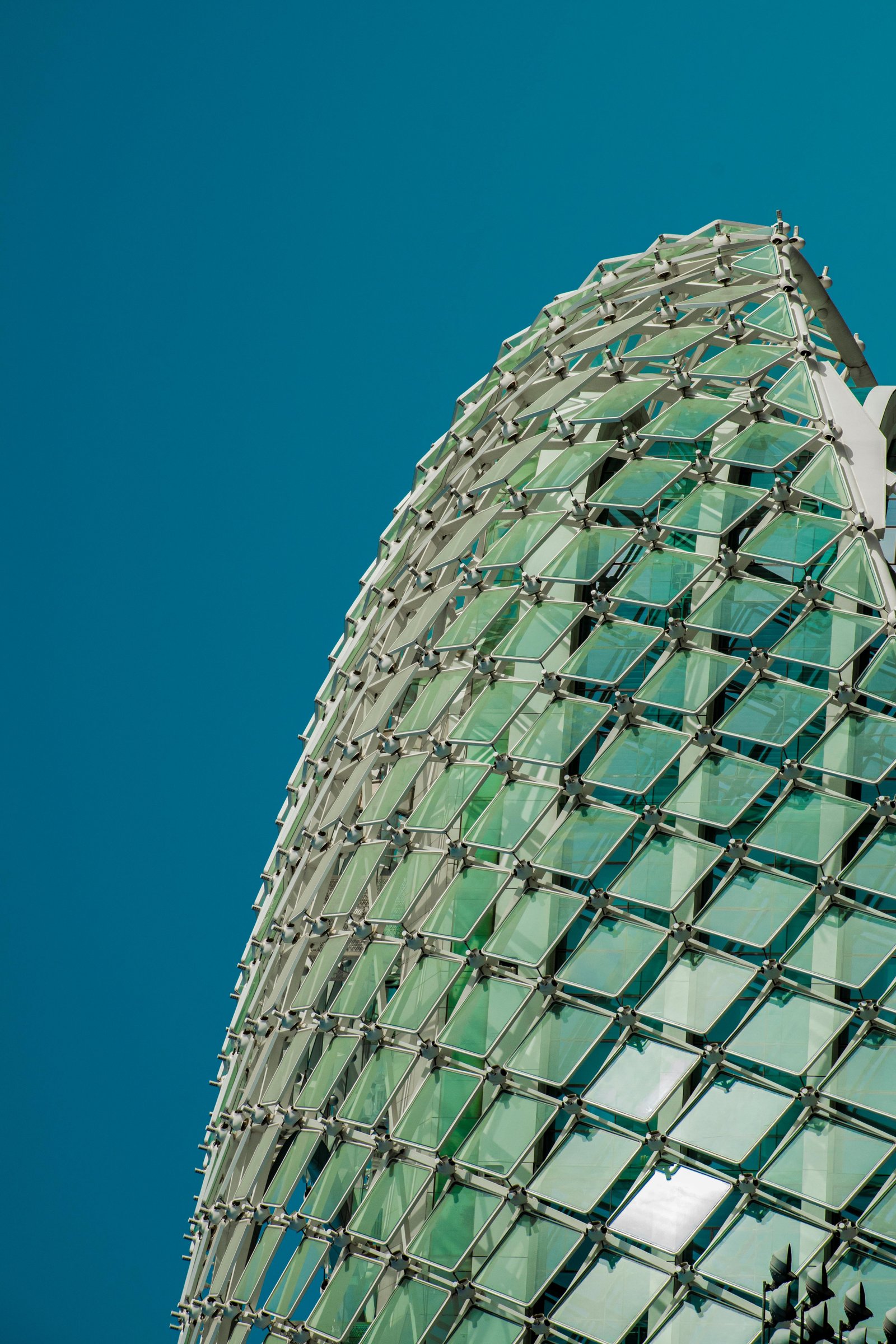 Geometric glass dome against sky