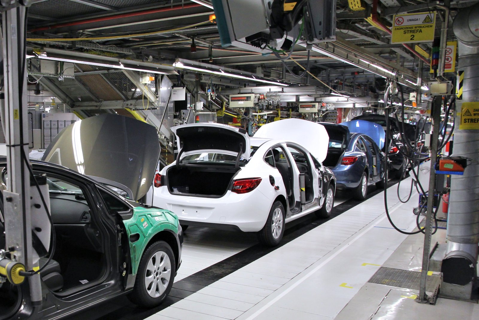 Cars being assembled in factory