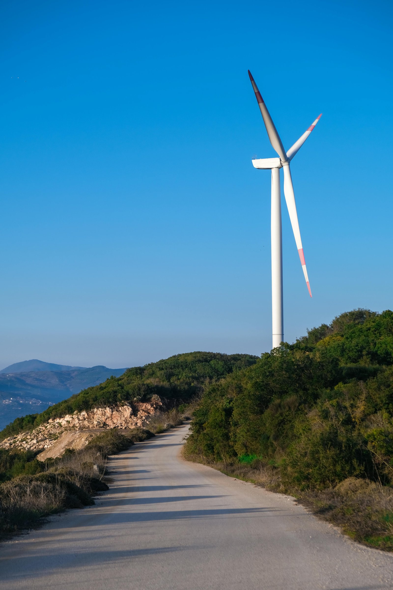 Wind turbine beside mountain road