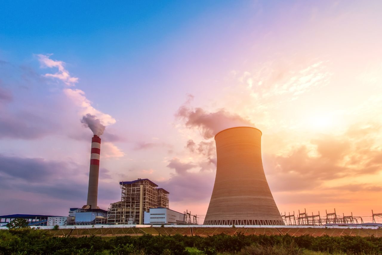 Industrial power plant at sunset